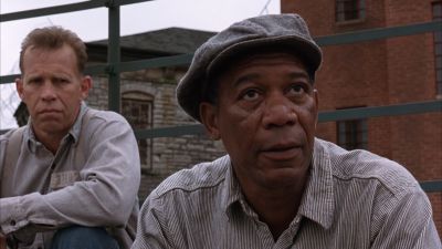 Still from The Shawshank Redemption (1994) that has been tagged with: day & exterior & two-shot & medium shot & prison yard
