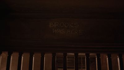 Still from The Shawshank Redemption (1994) that has been tagged with: 483c32 & graffiti & day