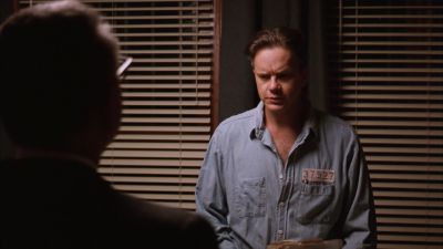 Still from The Shawshank Redemption (1994) that has been tagged with: medium shot & office & night