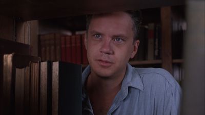 Still from The Shawshank Redemption (1994) that has been tagged with: medium close-up & library