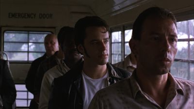 Still from The Shawshank Redemption (1994) that has been tagged with: bus interior & group-shot & day