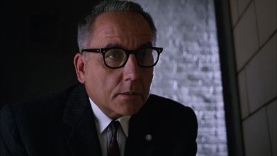 Still from The Shawshank Redemption (1994) that has been tagged with: 331414 & glasses & interior & medium close-up