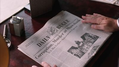 Still from The Shawshank Redemption (1994) that has been tagged with: interior & desk & newspaper & hand & insert
