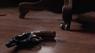 Still from The Shawshank Redemption (1994) that has been tagged with: interior & revolver & gun