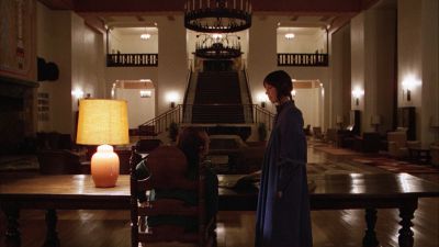 Still from The Shining (1980) that has been tagged with: stairs & lamp & two-shot & practical lamp & hotel lobby