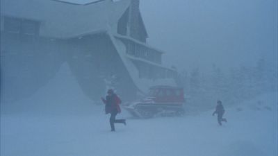 Still from The Shining (1980) that has been tagged with: two-shot & snow & exterior