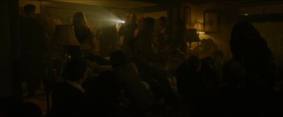 Still from The Social Network (2010) that has been tagged with: night & wide shot & flashlight & group-shot & interior & party
