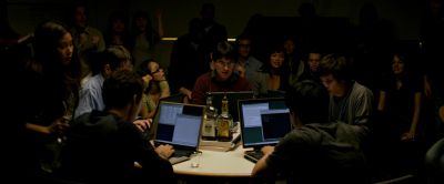 Still from The Social Network (2010) that has been tagged with: computer screen & group-shot & night