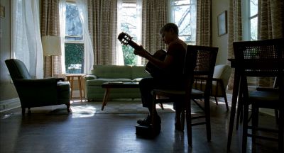 Still from The Tree of Life (2011) that has been tagged with: couch & guitar & interior