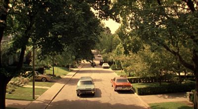 Still from The Virgin Suicides (1999) that has been tagged with: suburban street & extreme wide
