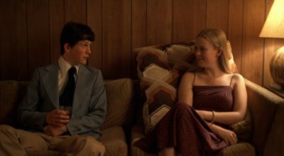 Still from The Virgin Suicides (1999) that has been tagged with: couch & practical lamp & living room & two-shot & interior