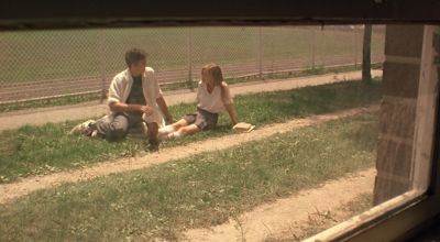 Still from The Virgin Suicides (1999) that has been tagged with: 836a54 & exterior & two-shot & wide shot & day