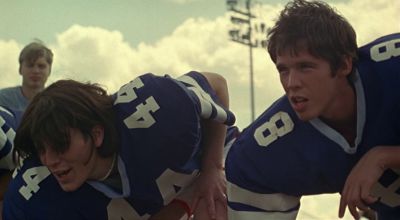 Still from The Virgin Suicides (1999) that has been tagged with: exterior & two-shot & football & day
