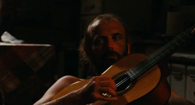 Still from The Wonders (2014) that has been tagged with: interior & guitar & night