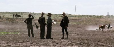 Still from There Will Be Blood (2007) that has been tagged with: historical & period & field & day & group-shot