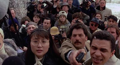Still from To Die For (1995) that has been tagged with: 714f38 & press conference & medium wide & group-shot
