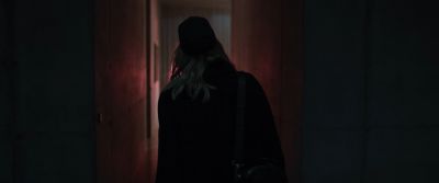 Still from Tár (2022) that has been tagged with: over-the-shoulder & doorway & night