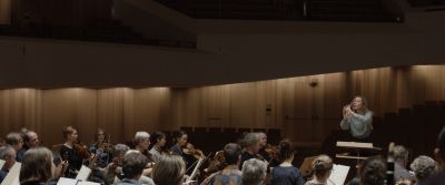 Still from Tár (2022) that has been tagged with: orchestra & group-shot