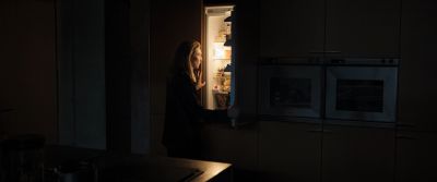 Still from Tár (2022) that has been tagged with: interior & wide shot & refrigerator
