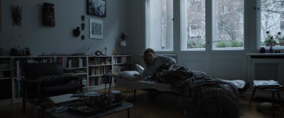 Still from Tár (2022) that has been tagged with: waking up & interior & wide shot