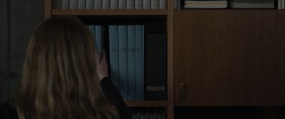 Still from Tár (2022) that has been tagged with: bookshelf