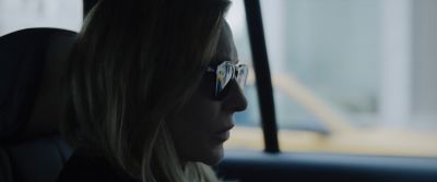 Still from Tár (2022) that has been tagged with: car interior & close-up & day & car & interior & sunglasses