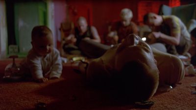Still from Trainspotting (1996) that has been tagged with: medium wide & low-angle & interior & day
