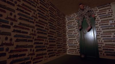 Still from Trainspotting (1996) that has been tagged with: night & dutch-angle & low-angle & clean single & interior & wide shot