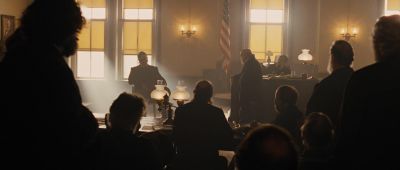 Still from True Grit (2007) that has been tagged with: wide shot & group-shot & courtroom