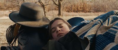 Still from True Grit (2007) that has been tagged with: day & medium close-up & exterior & sleeping & clean single