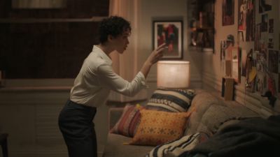 Still from Commercial: Apple - HomePod — "Welcome Home" that has been tagged with: living room & practical lamp & couch & clean single & pointing