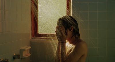 Still from Y Tu Mamá También (2001) that has been tagged with: shower & clean single & interior & profile shot